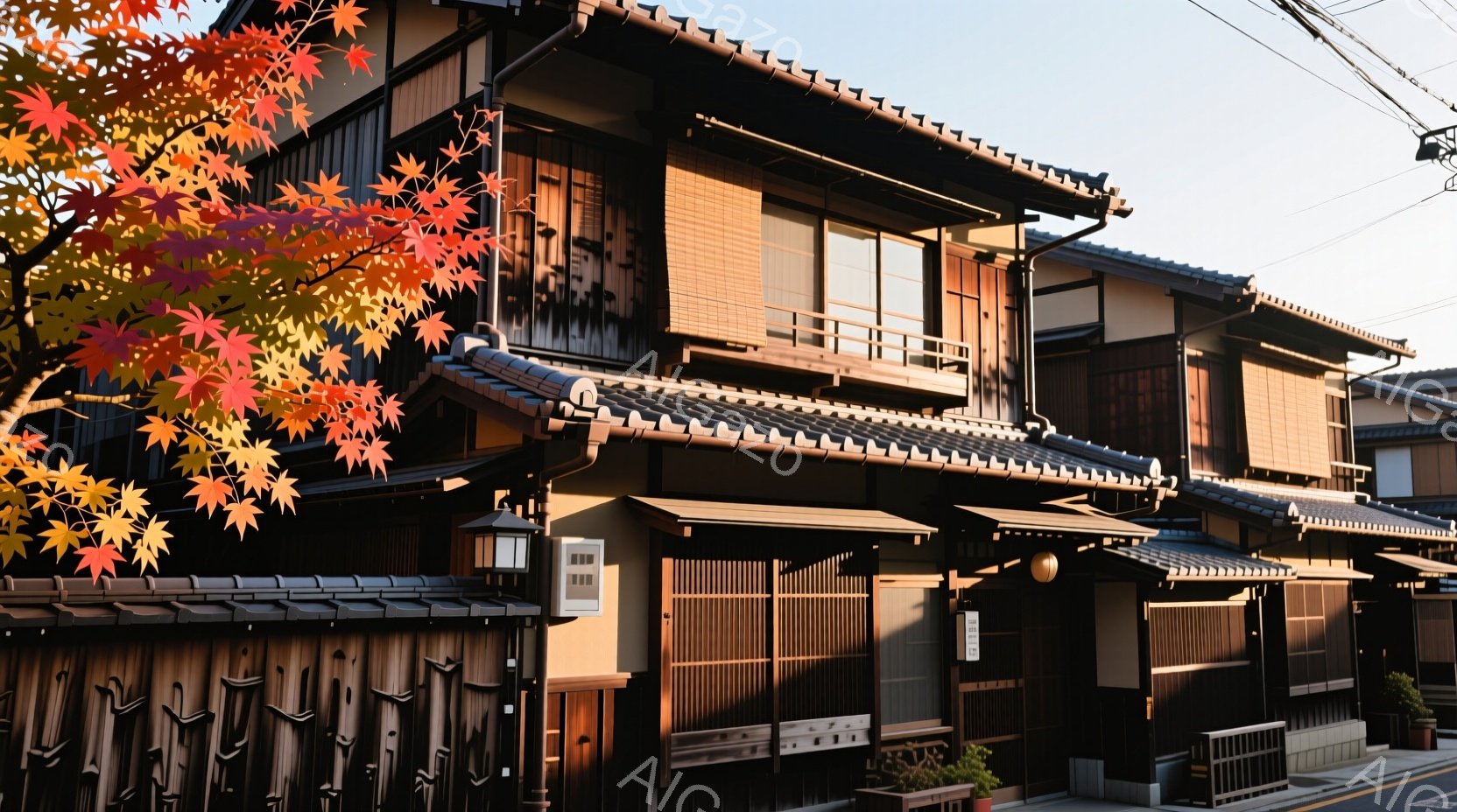 古都の並びに佇む木造建築の家並みが写っている。赤や黄色の紅葉が画面の左上を彩り、日差しの角度から秋の穏やかな午後の様子がうかがえる。建物は伝統的な日本の建築様式で、瓦屋根と木製の壁が特徴的で、落ち着いた雰囲気を醸し出している。
