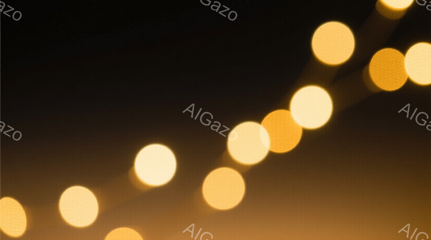 画像は、暗い背景にぼやけた黄色の光の点が連なっている様子を捉えている。光点は、まるで遠くの街灯や車のヘッドライトのようにぼやけており、動きのある印象を与える。全体的に暖かく幻想的な雰囲気で、夜の街の光景を想起させる。