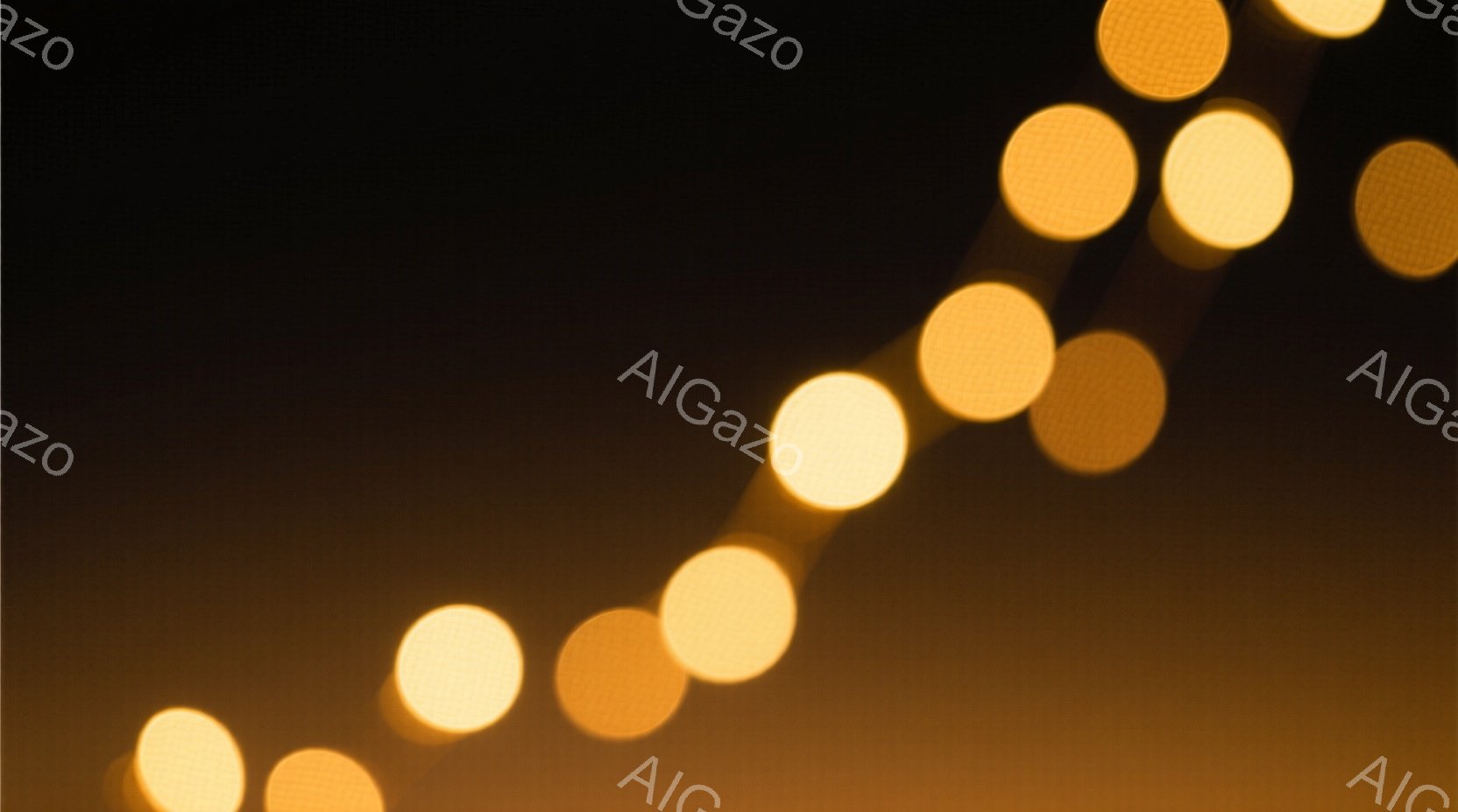 画像は暗い背景にぼやけた黄金色の光の点が対角線状に並んでいる様子を表しています。光の点は丸みを帯びており、まるで遠くの街灯やイルミネーションのように見えます。全体的に温かく幻想的な雰囲気を醸し出しています。