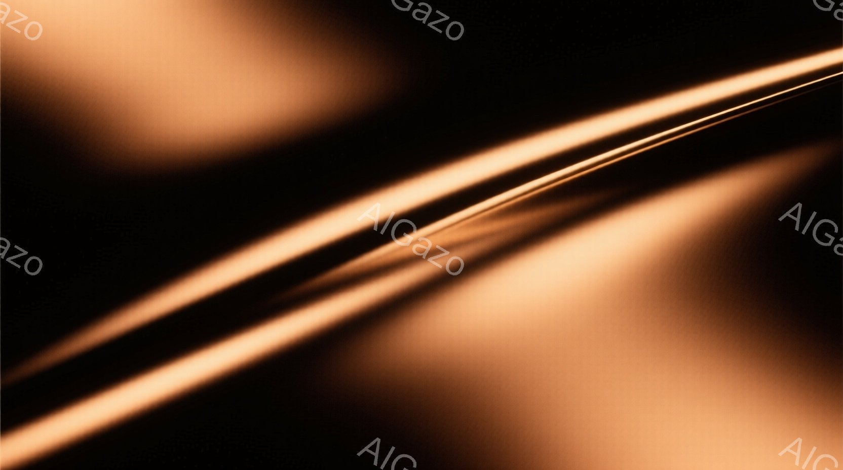 画像は、ぼやけたオレンジ色の線が複数、対角線状に走る抽象的な構成です。光の反射や陰影が強調され、柔らかく暖かい雰囲気を醸し出しています。具体的な人物や背景は特定できず、色彩と光のグラデーションが主な要素となっています。