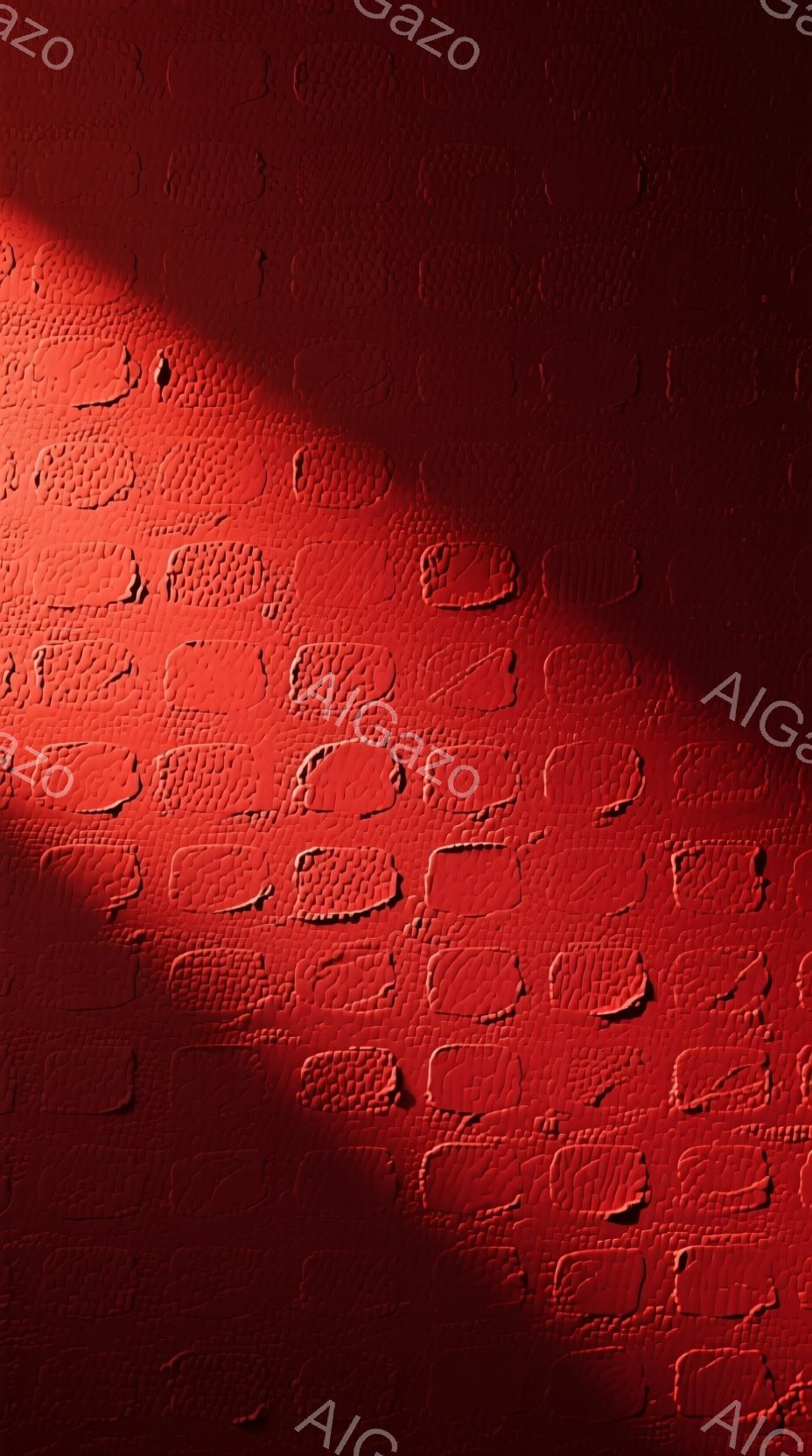 この画像は、鮮やかな赤色の陰影が特徴的なテクスチャ画像である。表面には凹凸があり、まるで何らかの模様が刻まれた壁のようにも見える。全体的に影が強調されており、深みと立体感のある雰囲気を作り出している。