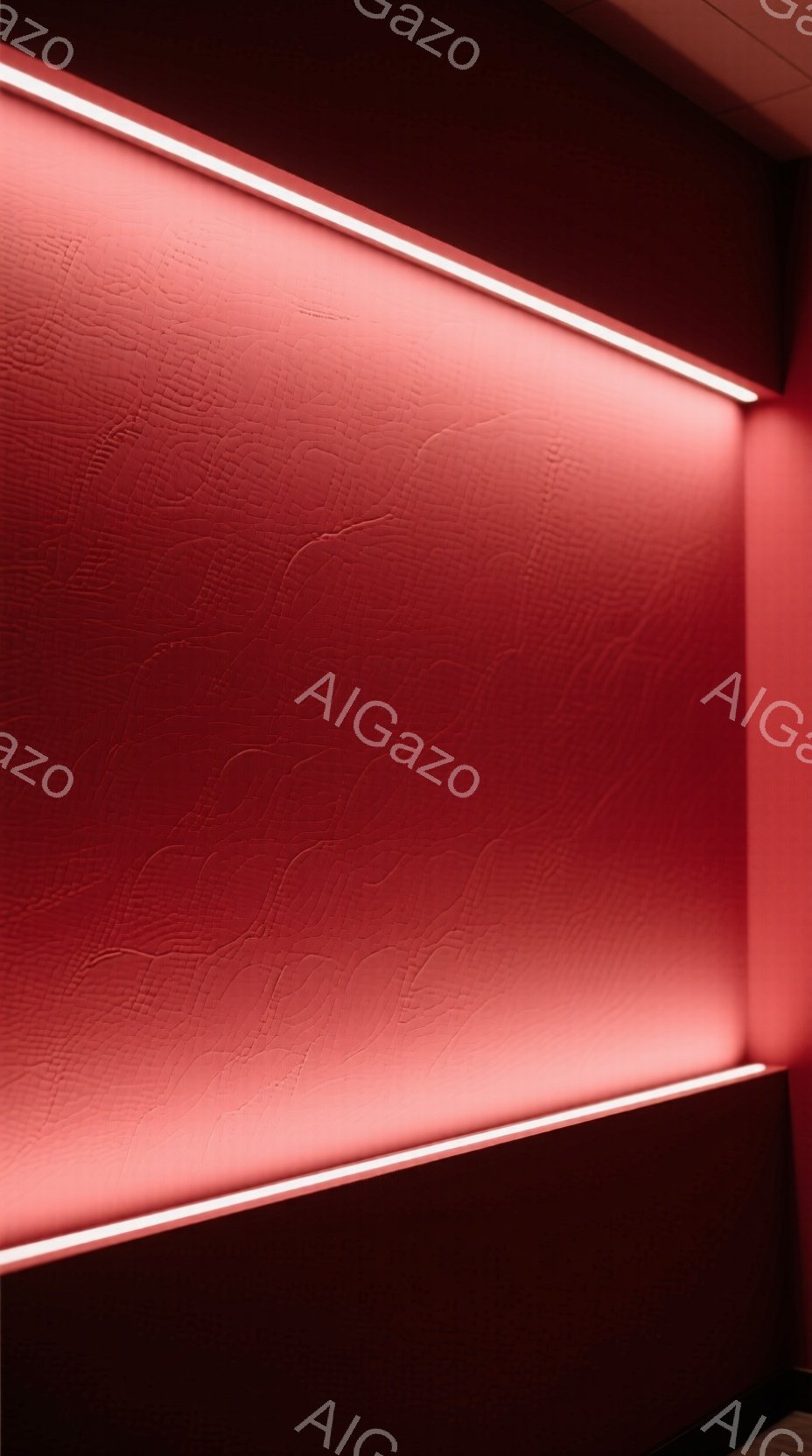 赤色の壁が特徴的な画像です。壁には、細かい凹凸のあるテクスチャが施されており、上部には明るい白色の照明が水平に配置されています。全体的に暖かく、モダンで、やや未来的な雰囲気を醸し出しています。