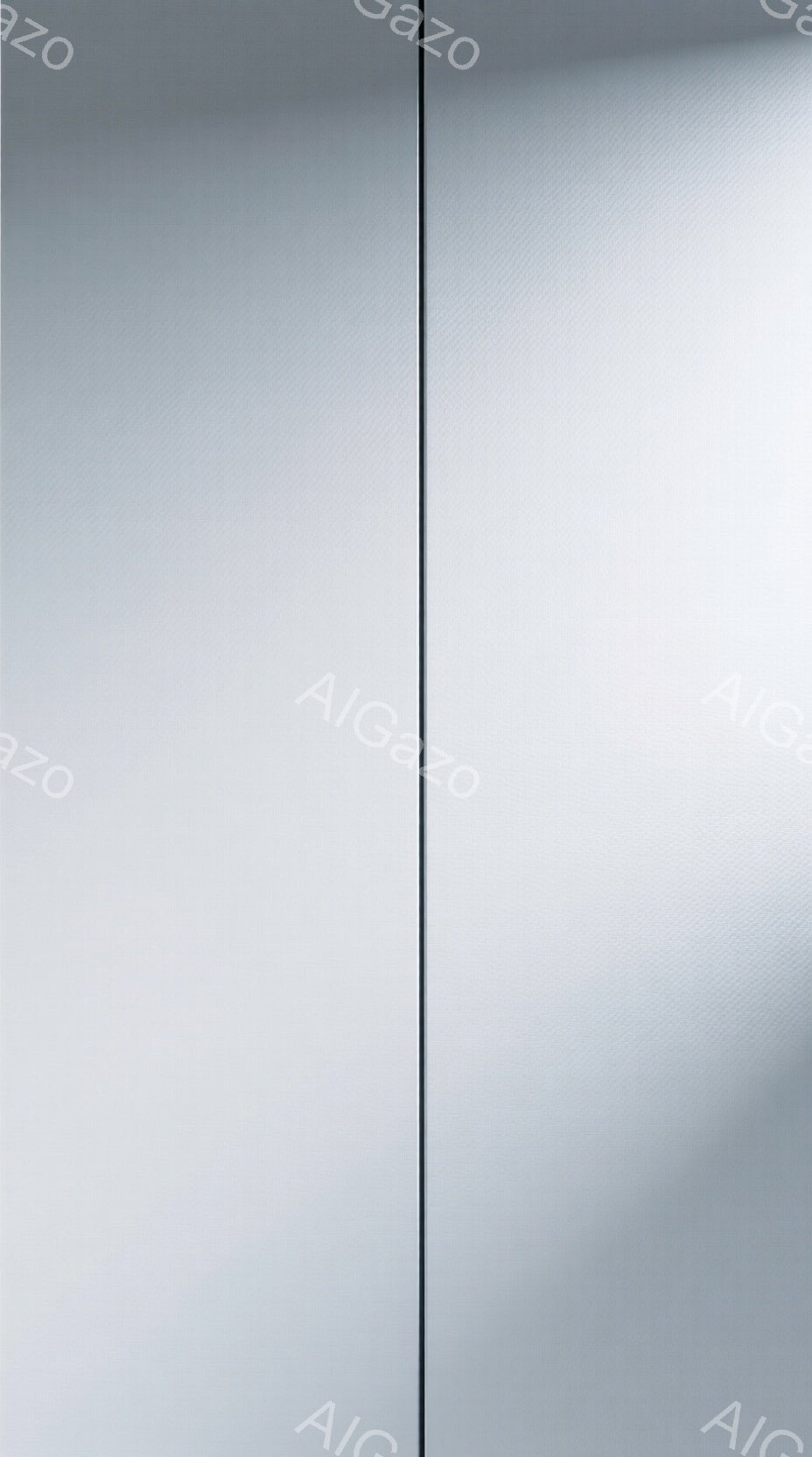 画像は、均一なグレーの表面を捉えたクローズアップショットで、素材の質感と微妙な陰影が際立っている。表面には目に見えないテクスチャが存在し、光の当たり方によって微妙な凹凸が表現されている。全体としてミニマルで無機質な印象であり、素材そのものの持つ美しさを強調している。