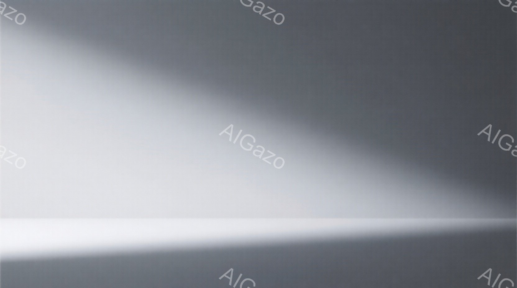 この画像は、光が当たる部分と影の部分がはっきりと分かれており、人物や具体的な被写体は見当たりません。全体的に白とグレーのグラデーションで構成されており、ミニマルで抽象的な印象を与えます。光の強弱によって空間の奥行きが強調され、静寂で幻想的な雰囲気が漂っています。