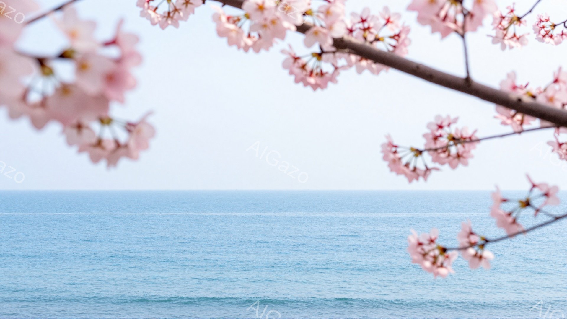 淡いピンク色の桜の花びらが画面の周りを縁取り、青い海と空が広がる風景が描かれている。穏やかな波が打ち寄せ、空は晴れ渡っているため、春の穏やかで平和な雰囲気が漂っている。桜の花びらが海辺の風景に柔らかさ - AI生成フリー素材