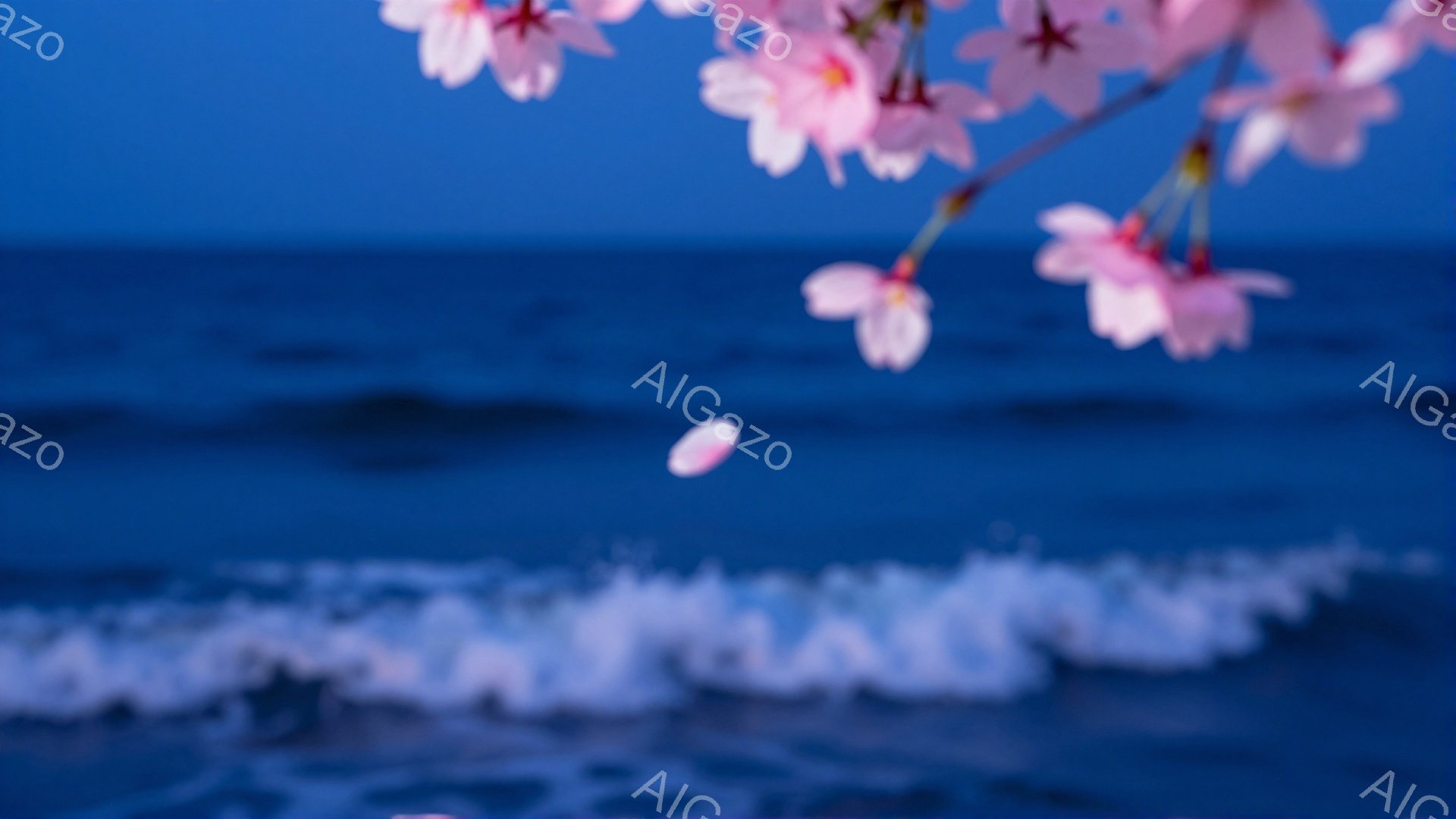 桜の花びらが海面に舞い散る様子が捉えられています。空と海は深い青色で、波の白い泡がコントラストをなしています。全体的に幻想的で穏やかな雰囲気が漂い、春の儚さを感じさせます。