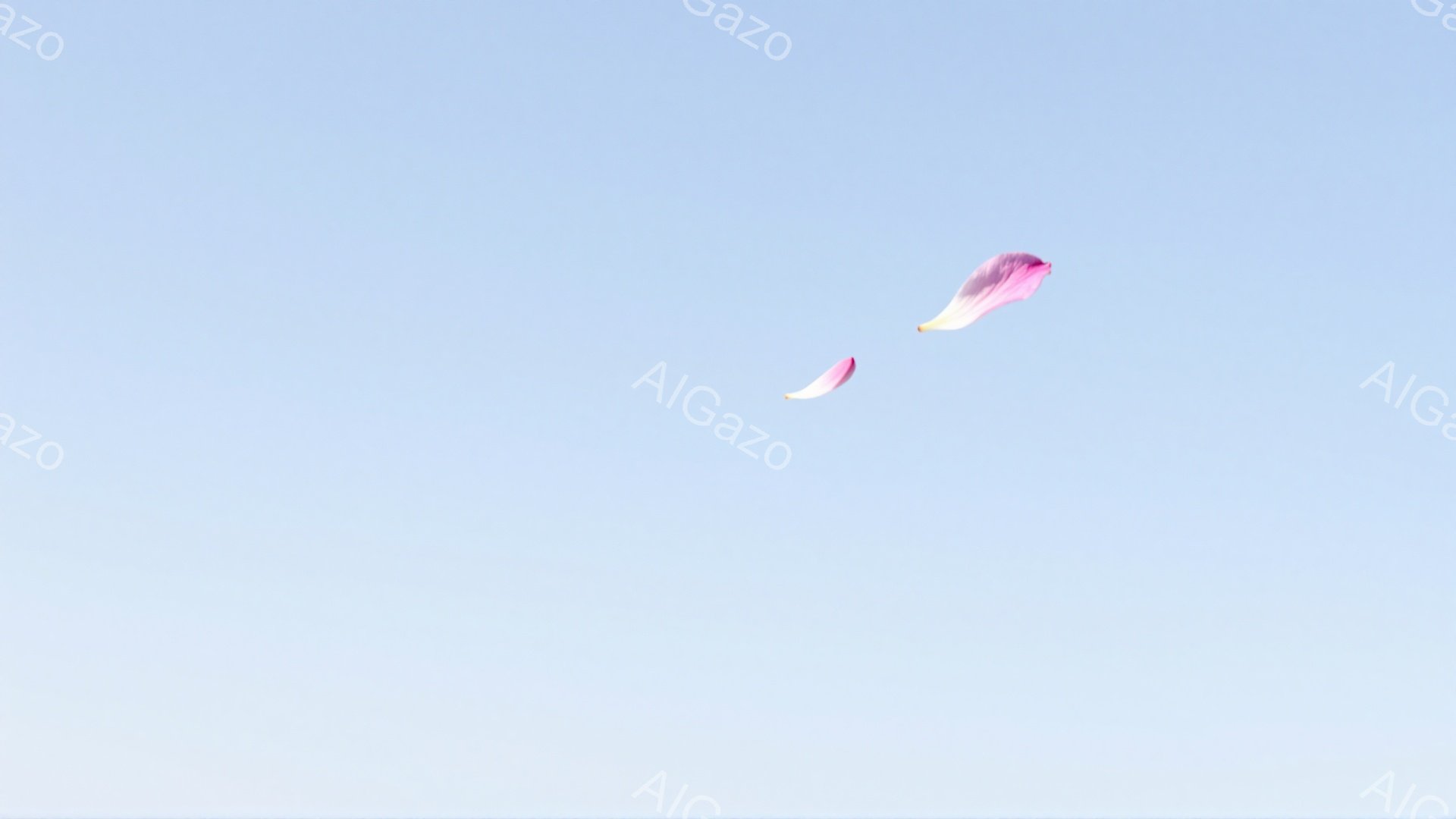 空一面に淡い水色の背景が広がり、ピンク色の桜の花びらが二枚、まるで舞い落ちるように漂っている。花びらはわずかにカールしており、光を受けて柔らかく輝いているように見える。穏やかで静謐な春の日の雰囲気が感じられる。