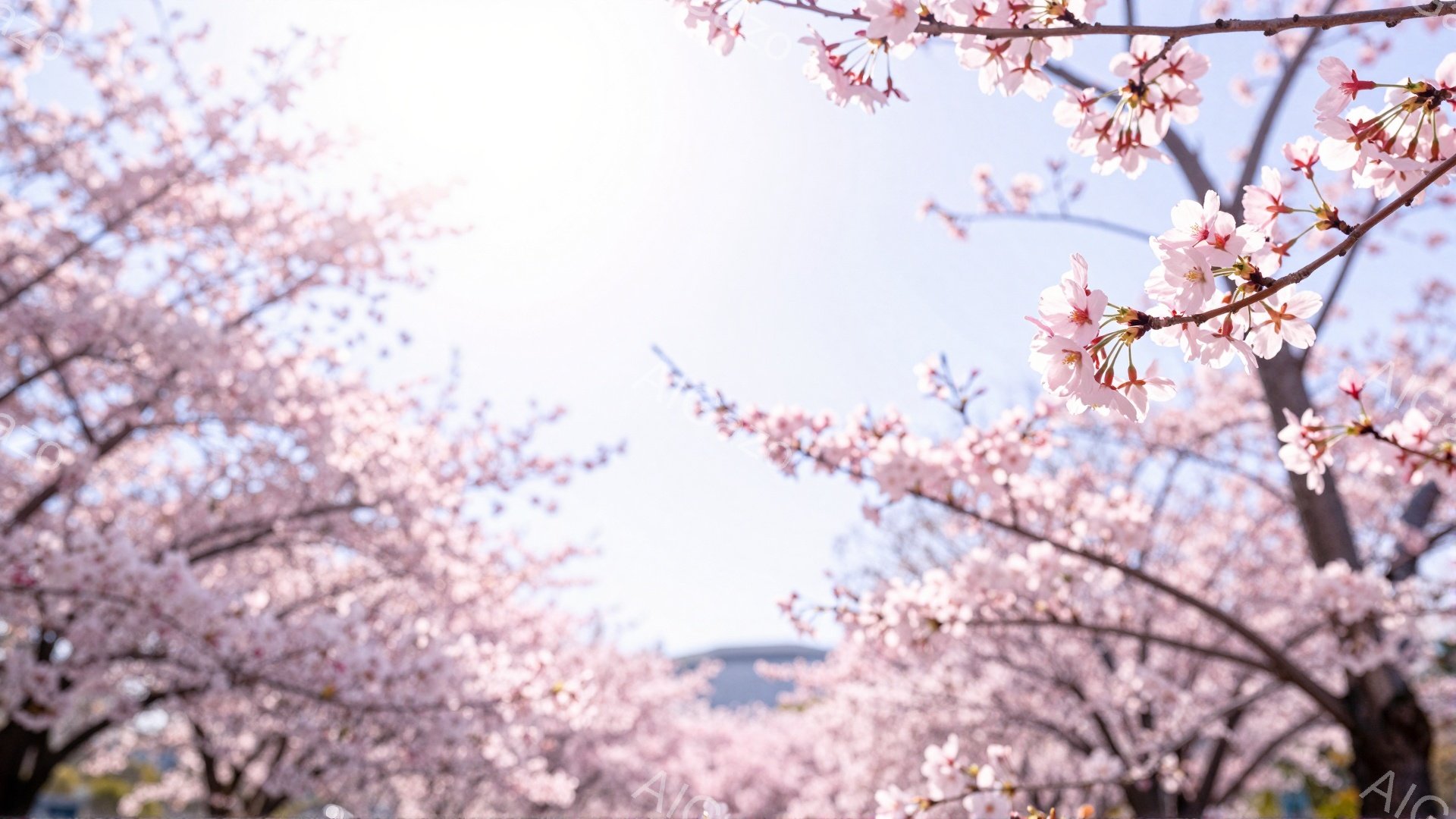 桜の花びらが咲き誇り、春の訪れを感じさせる風景です。空は明るく、背景にはぼんやりと建物が見え、全体的に優しい雰囲気です。ピンク色の花びらが視界いっぱいに広がり、まるで春のトンネルのようです。 - AI生成フリー素材