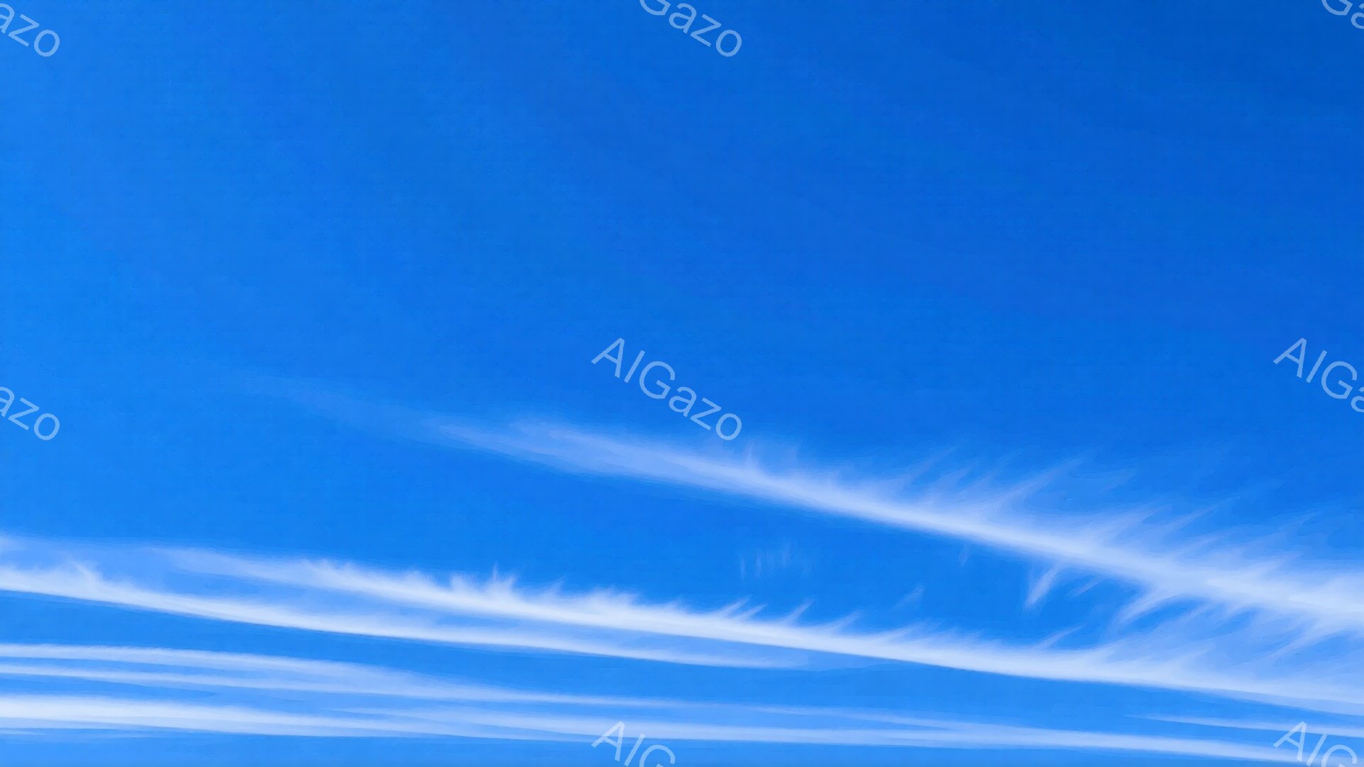 広大な青空に、白い筋状の雲が幾本か描かれている。まるで筆で空をなぞったかのような、繊細で美しい雲の流れが印象的だ。晴れ渡った空と白い雲のコントラストが、爽やかで開放的な雰囲気を醸し出している。