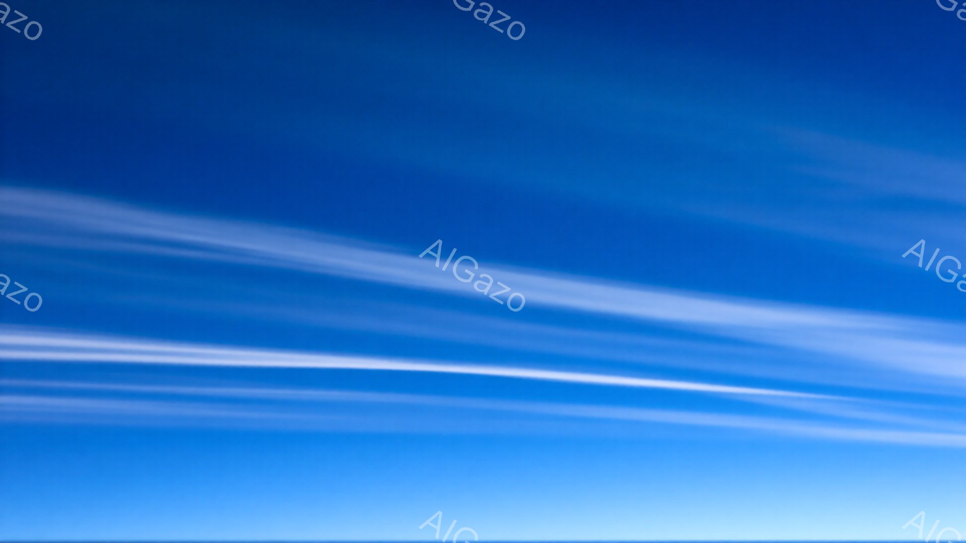 鮮やかな青空に白い筋状の雲が何本も水平方向に広がっている。雲はまるで筆で描いたようにぼやけ、動きのある空模様を作り出している。空全体は明るく開放的な印象を与え、平和で穏やかな雰囲気を醸し出している。