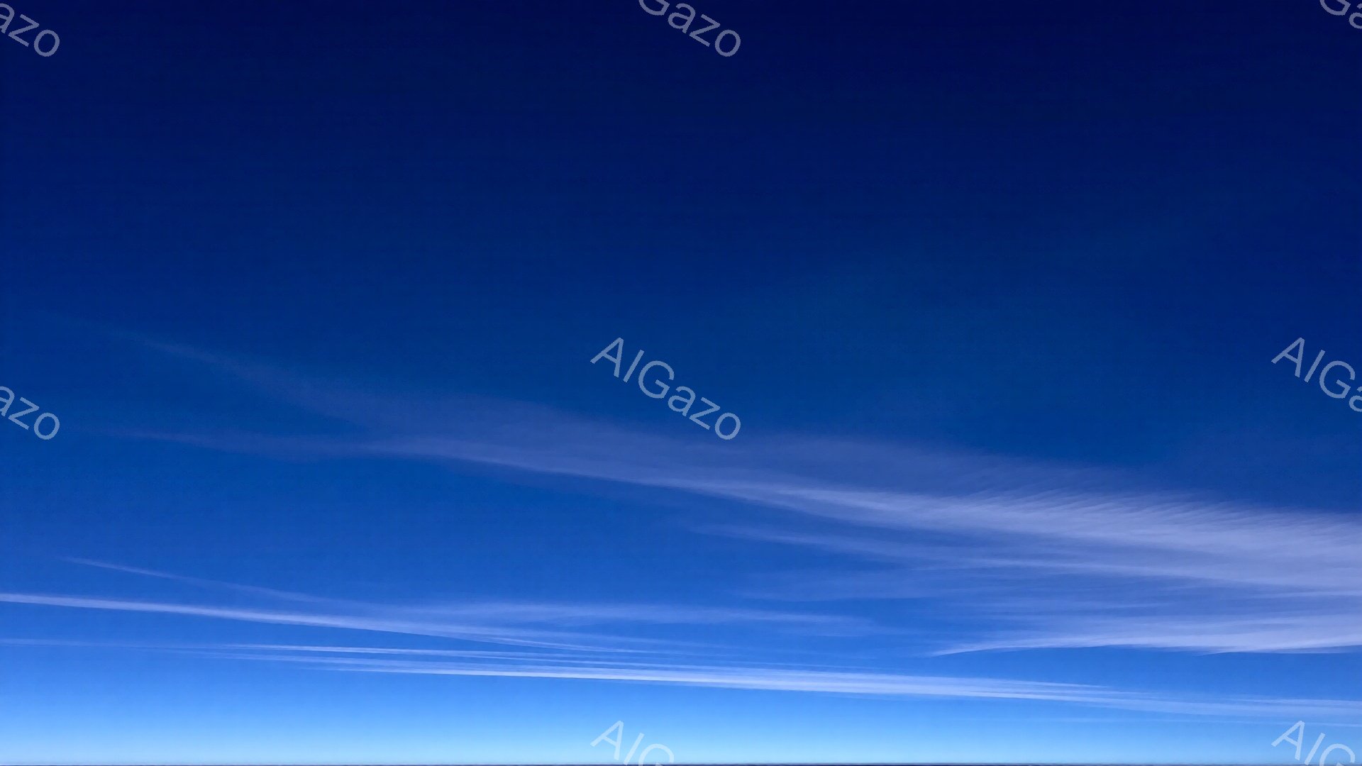 鮮やかな青空に、白い筋状の雲がところどころに広がっている。雲は細長く、まるで筆で描いたような繊細な形をしており、空の青さを際立たせている。全体的に晴れ渡った空の穏やかで開放的な雰囲気が感じられる。 - AI生成フリー素材