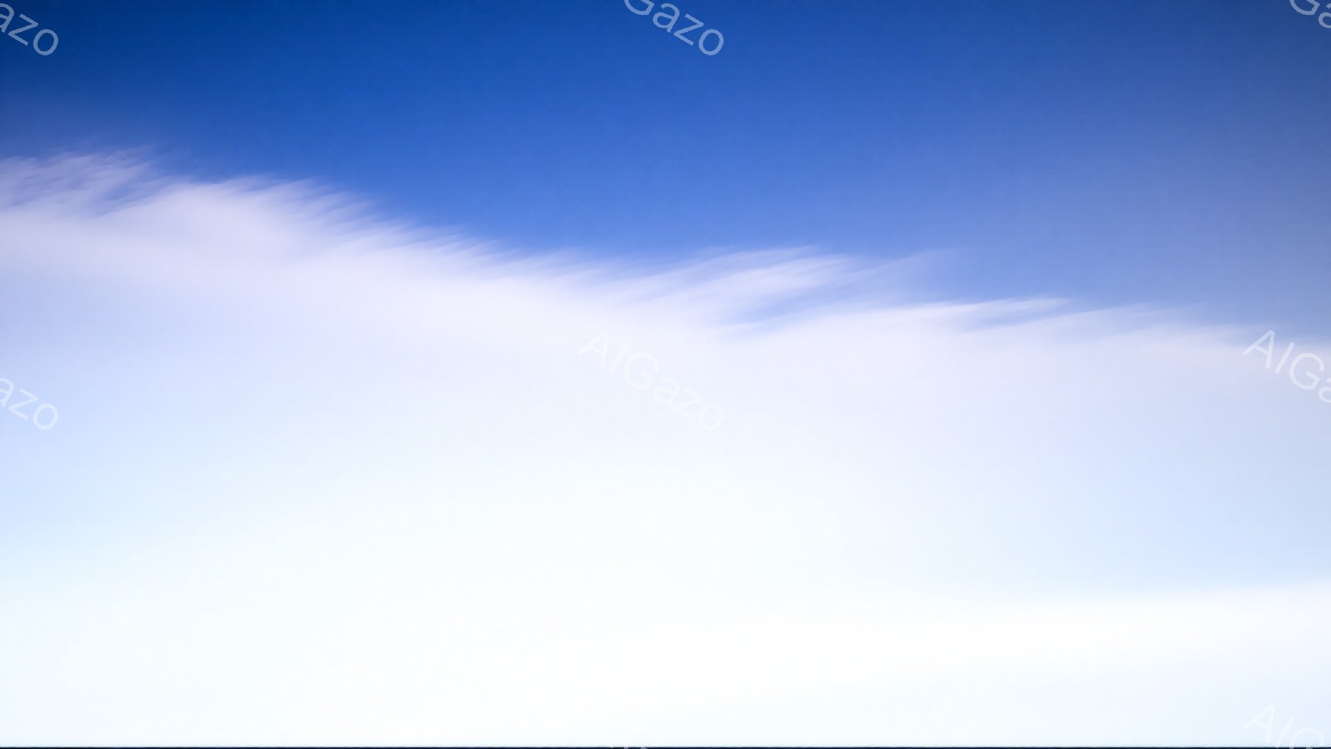 この画像は、鮮やかな青い空に白い雲が広がっている様子を捉えたものです。雲はまるで筆で描いたような、流れるような美しい形をしており、空全体に穏やかな雰囲気をもたらしています。背景に建物や自然は見当たらず、空と雲のみが際立っています。