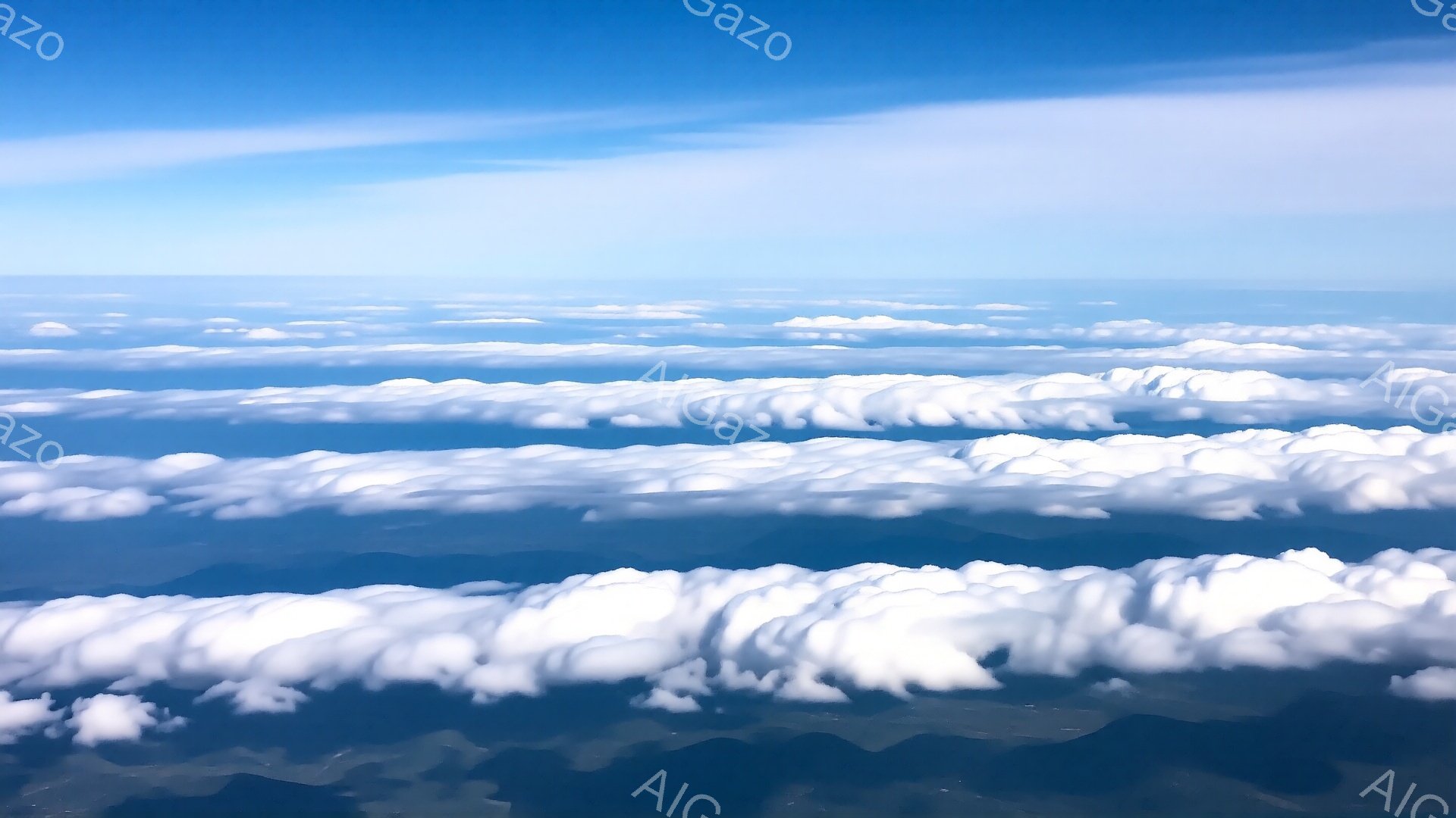 広大な空から見下ろす、まるで波のような白い雲が連なっている。雲の下には緑色の山々がうっすらと見え隠れし、壮大な自然の風景が広がっている。青空と白い雲のコントラストが印象的で、爽やかで開放的な雰囲気を醸 - AI生成フリー素材
