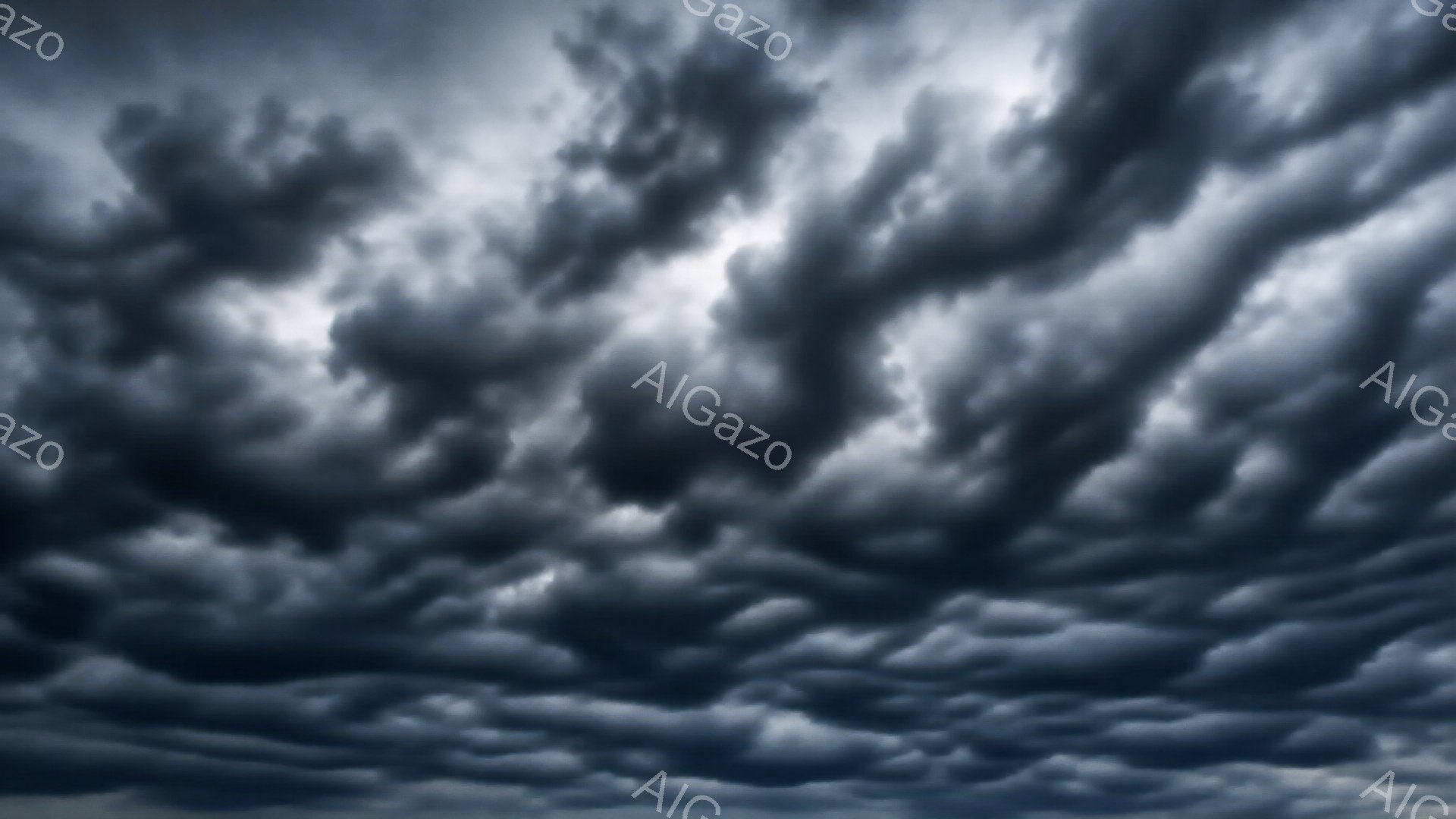 雲が空全体を覆い、重々しい雰囲気を醸し出しています。厚い灰色の雲は、まるで波のようにうねり、激しい嵐の前触れを感じさせます。光がほとんど届かず、暗くドラマチックな空模様が広がっています。