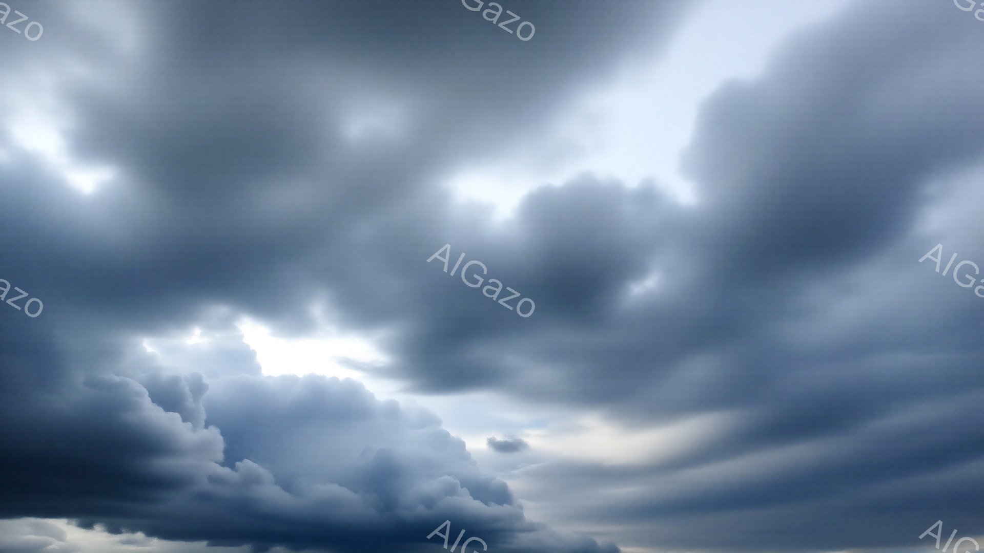 厚い雲が空を覆い、強い光が雲間から差し込んでいる。雲の形は重く、迫力があり、まるで嵐が近づいているかのような雰囲気を作り出している。全体的に暗く、ドラマチックな空模様が印象的である。
