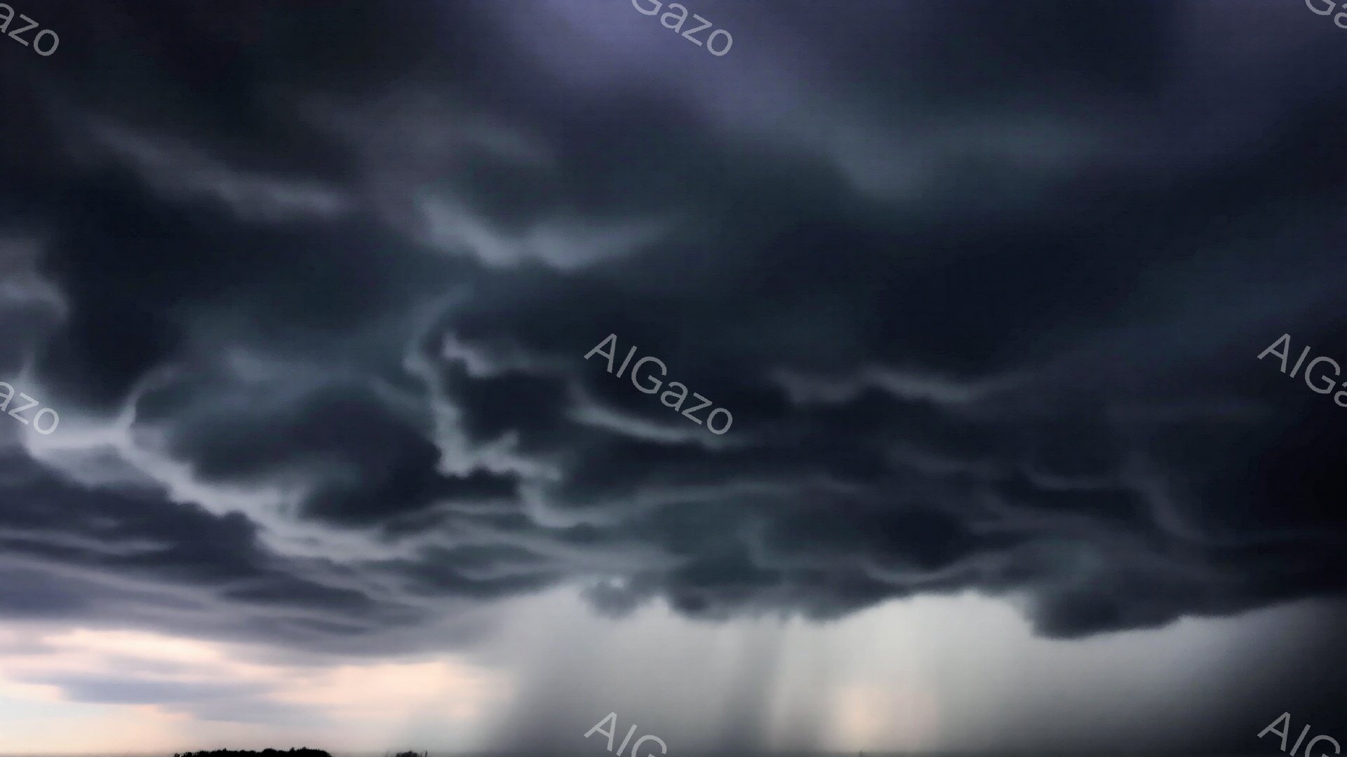 厚い暗雲が空一面を覆い、まるで巨大な壁のように広がっています。雲の下部からは白い雨が滝のように降り注ぎ、地上の風景をぼやけさせています。薄暗い光が雲の端を照らし出し、不気味でありながら壮大な雰囲気を醸し出しています。