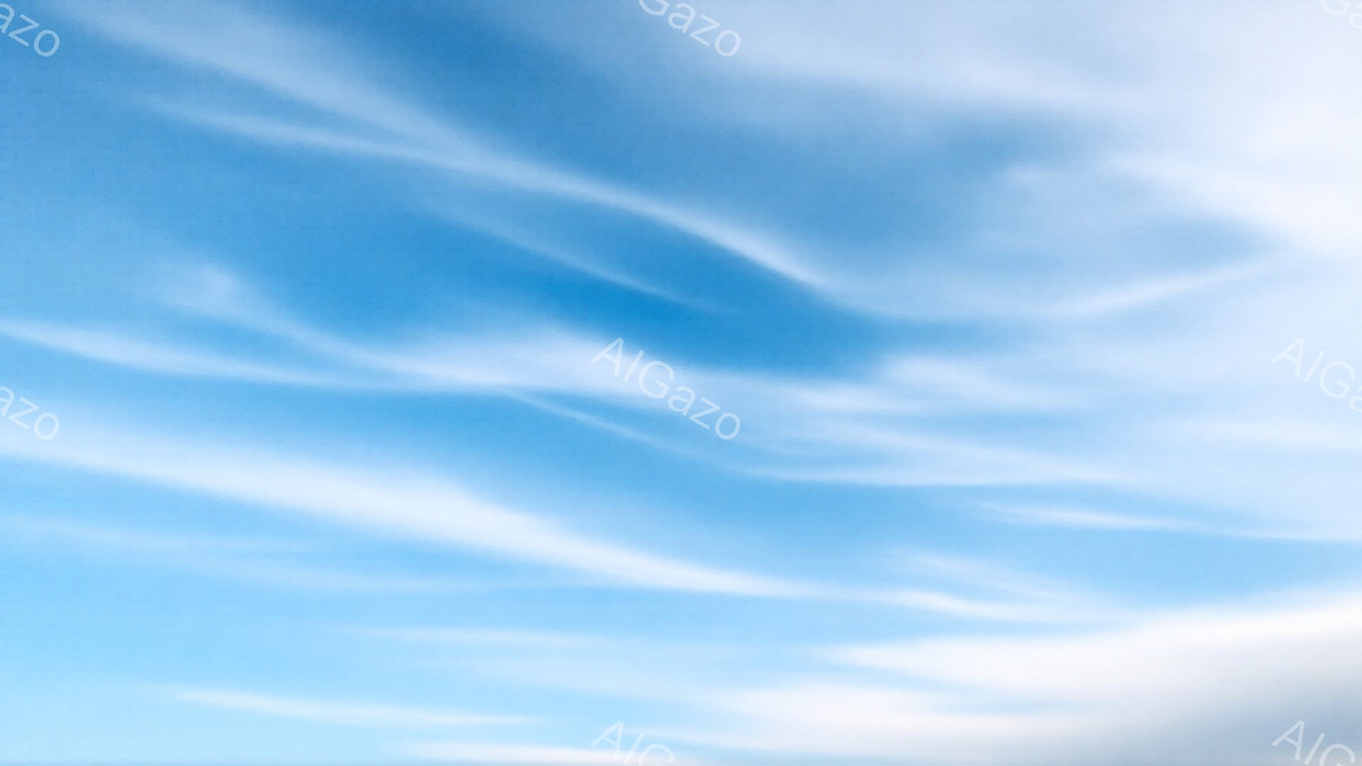 空一面に白い筋状の雲が広がり、まるで筆で描いたような繊細な模様を作り出している。青空は明るく澄み渡り、雲の白さが際立っている。穏やかで爽やかな印象を与える、平和な空の風景だ。