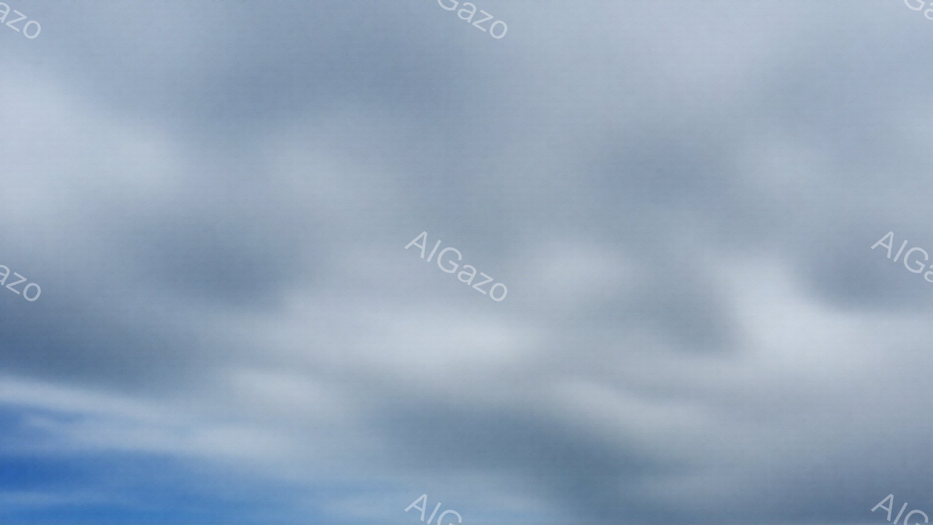 雲が空一面に広がり、明るい青空とのコントラストが印象的です。雲は白くふっくらとしており、まるで綿菓子のように見えます。穏やかな天気で、のどかな雰囲気を感じさせます。
