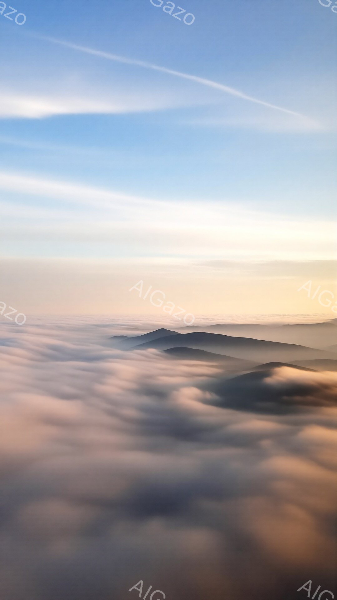 穏やかな朝の光に照らされた山々の風景が広がっている。厚い雲海が山々を覆い、まるで海の上に浮かぶ島々のように見える。空は淡い青色からオレンジ色へとグラデーションを描き、静寂で幻想的な雰囲気を醸し出してい - AI生成フリー素材