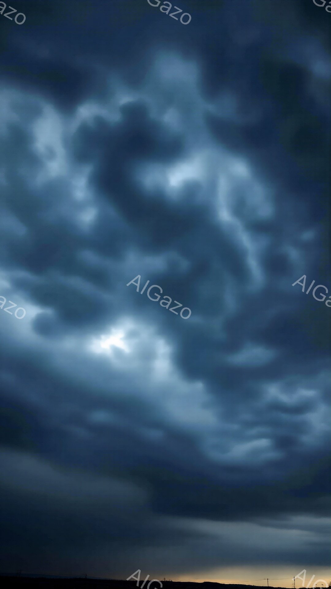 激しい雲が空を覆い、暗くドラマチックな雰囲気を作り出しています。地平線にはぼんやりとしたシルエットが見え、わずかな光が雲間から差し込み、緊張感と神秘性を高めています。全体的に、迫り来る嵐や自然の力の圧倒的な美しさを感じさせる一枚です。