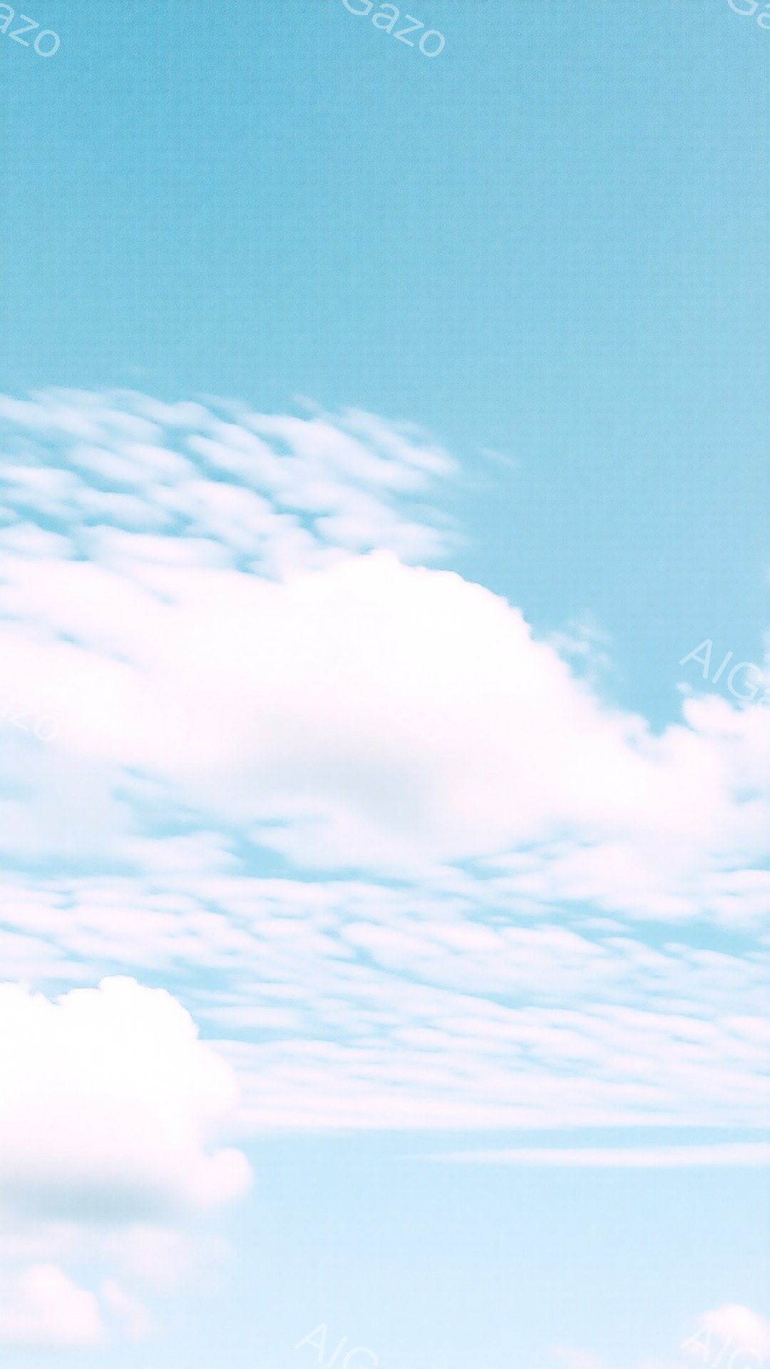 鮮やかな青空に、白い雲が広がり、まるで羊の毛のような細かい雲が全体を覆っています。左上には、もくもくと高く盛り上がった雲がアクセントとして存在し、空全体に穏やかで開放的な雰囲気をもたらしています。日中は、おそらく晴天で、夏の空を連想させる光景です。