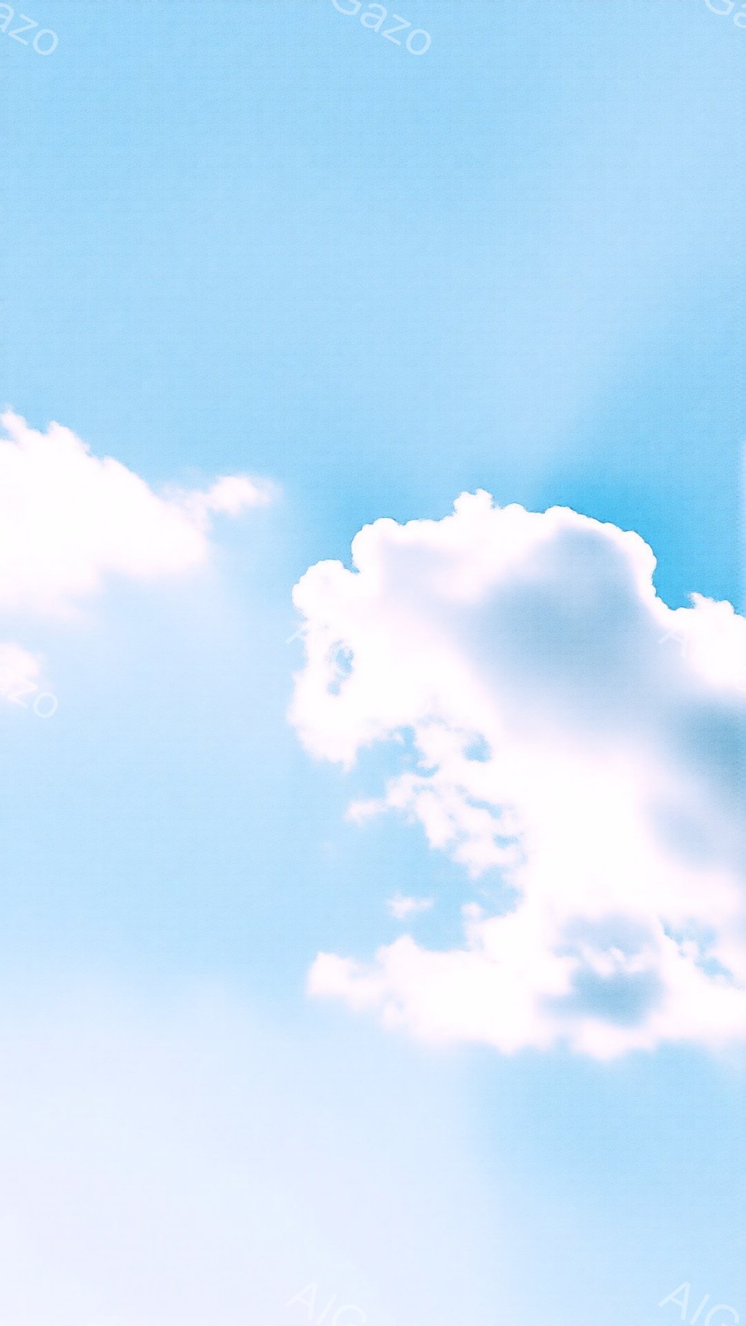 鮮やかな青空に白い雲が浮かんでいます。雲は様々な形をしており、まるで綿菓子のように柔らかい印象を与えます。背景はどこまでも広がる青空で、穏やかで平和な雰囲気が漂っています。