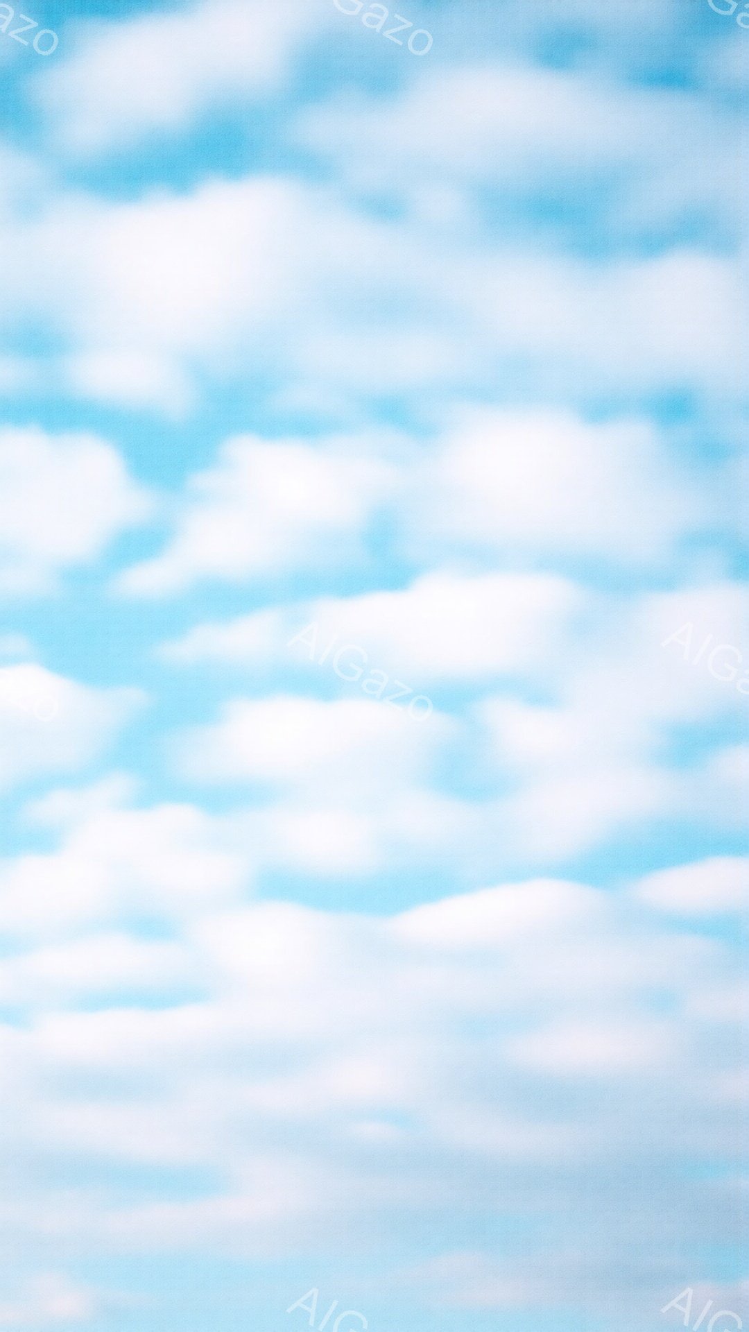 空一面に白い雲が広がっており、まるで綿菓子のようなふんわりとした印象を与えます。雲の形は様々で、所々青空が覗き、明るく爽やかな雰囲気が漂っています。穏やかで平和な、晴れた日の空の風景です。