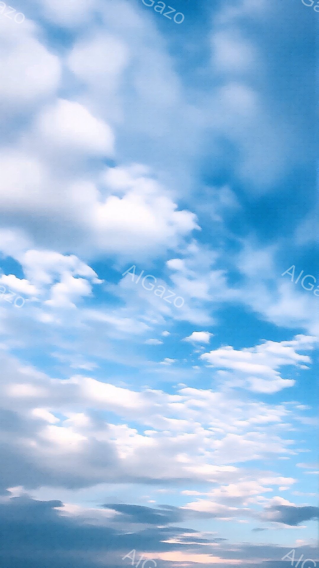 鮮やかな青空に、白い雲がふわふわと浮かんでいます。雲は様々な形をしており、まるで綿菓子のようです。全体的に晴れ渡った穏やかな空模様で、爽やかな印象を与えます。 - AI生成フリー素材
