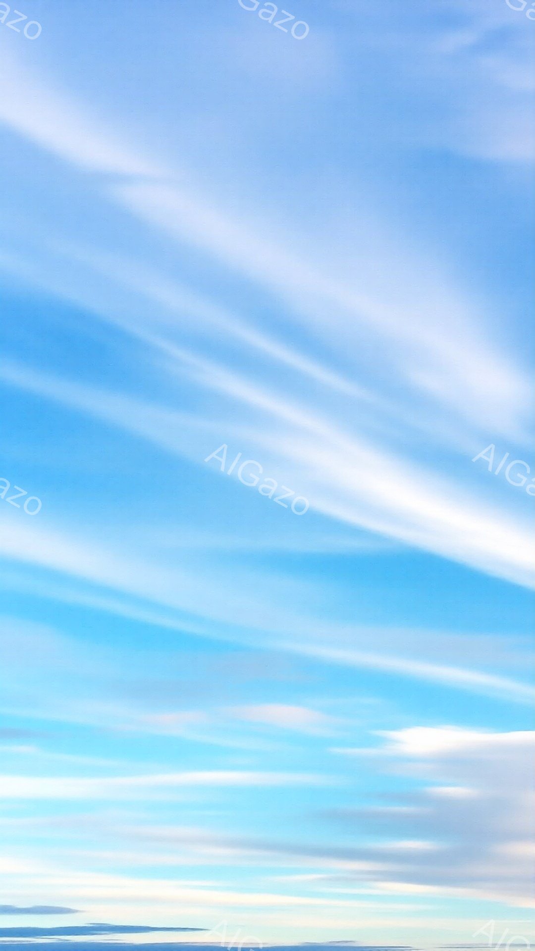 広大な青空に、白い筋状の雲が幾重にも広がっている。雲の流れは流れるように滑らかで、穏やかで平和な雰囲気を醸し出している。空は明るい水色から深い青色へとグラデーションしており、まるで絵画のような美しさだ。