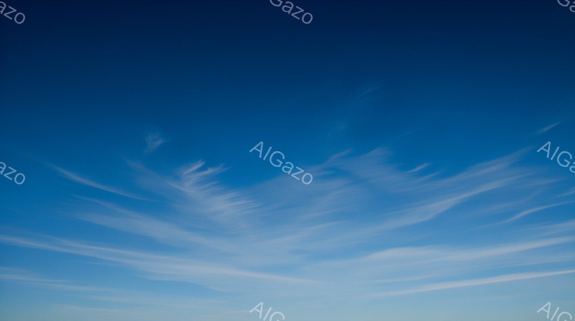 空は鮮やかな青色で、繊細な白い筋雲が広範囲に広がっている。雲はまるで羽毛のような形をしており、風によって引き伸ばされたように見える。穏やかで静謐な雰囲気を醸し出し、空は晴れ渡り、爽やかな一日を予感させる。