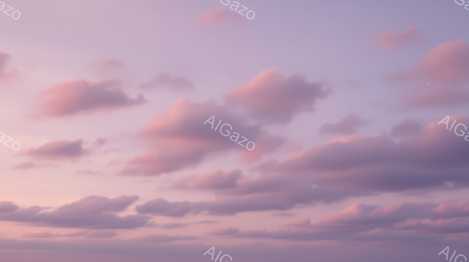 薄紫色の空に、桃色と紫色の雲が広がり、まるで絵画のような美しい光景が広がっている。雲は様々な形をしており、夕焼けの光を受けて柔らかく輝いている。穏やかで幻想的な雰囲気で、静寂と安らぎを感じさせる。