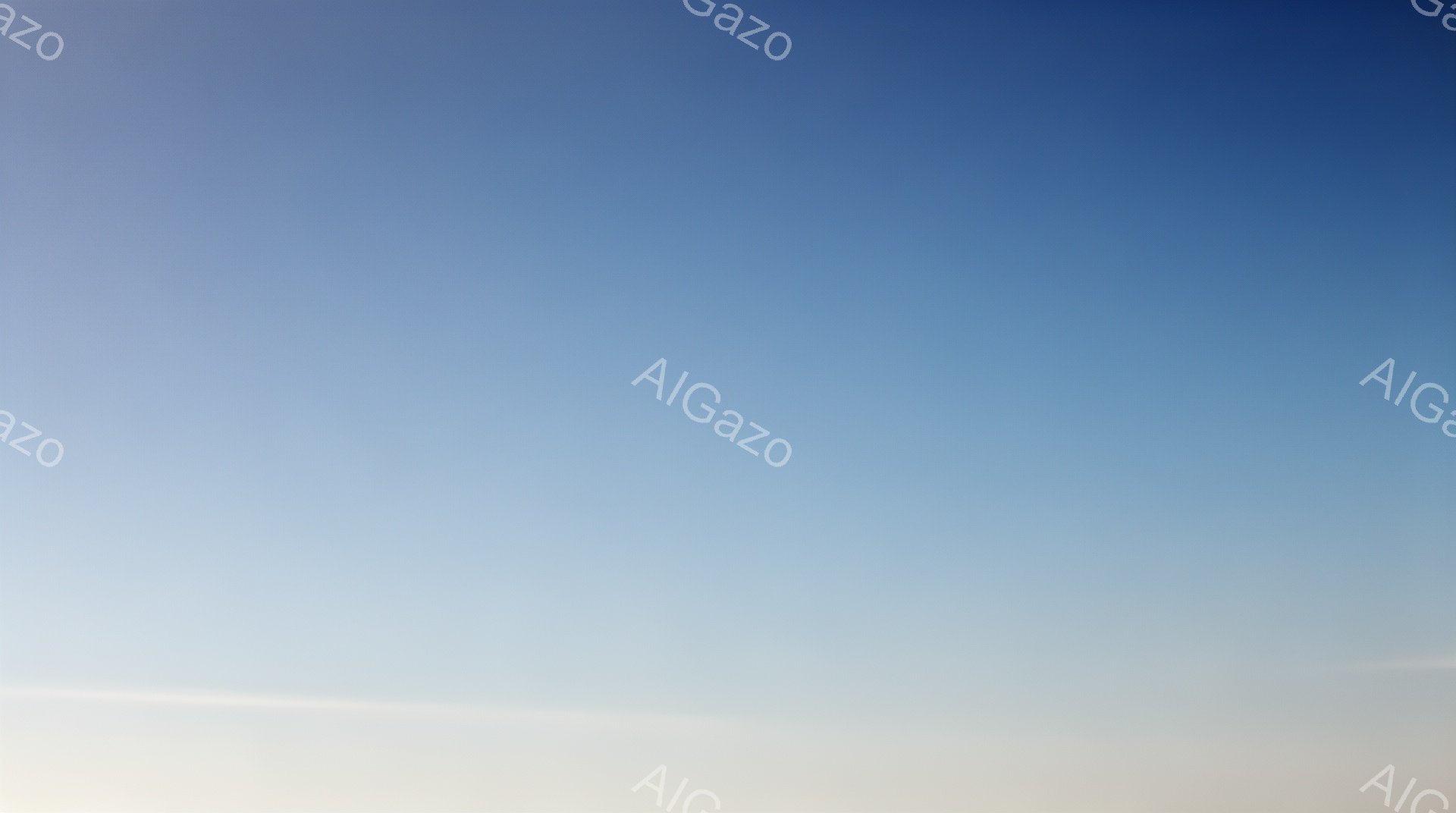 空は淡い水色から白へとグラデーションになっており、穏やかで静かな雰囲気を醸し出しています。地平線近くは明るい白色で、上空へ向かうにつれて徐々に濃い青色へと変化しています。雲はほとんど見当たらず、晴れた空が広がっています。