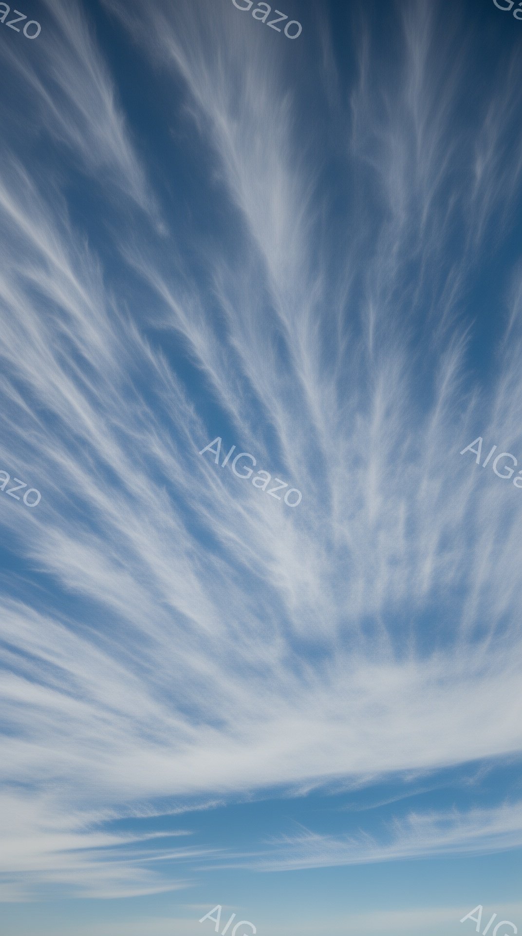 鮮やかな青空に、まるで筆で描かれたような白い筋状の雲が広がっている。雲は空を横切るように流れ、まるで天使の羽や髪のようにも見える。穏やかで静謐な雰囲気であり、晴れ渡った空が広がり、心地よい開放感を与えている。